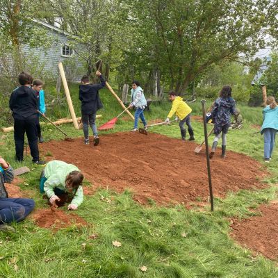 image of children working a large garden