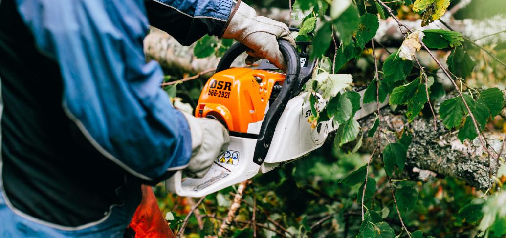 person using a chainsaw