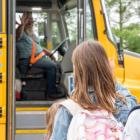 image of children getting on a school bus