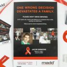 image of a poster with red ribbon and brochures on both side of it 