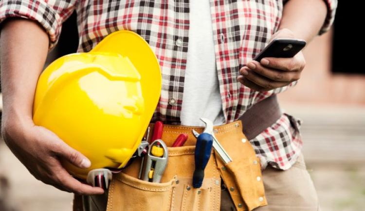 person holding a hard-hat